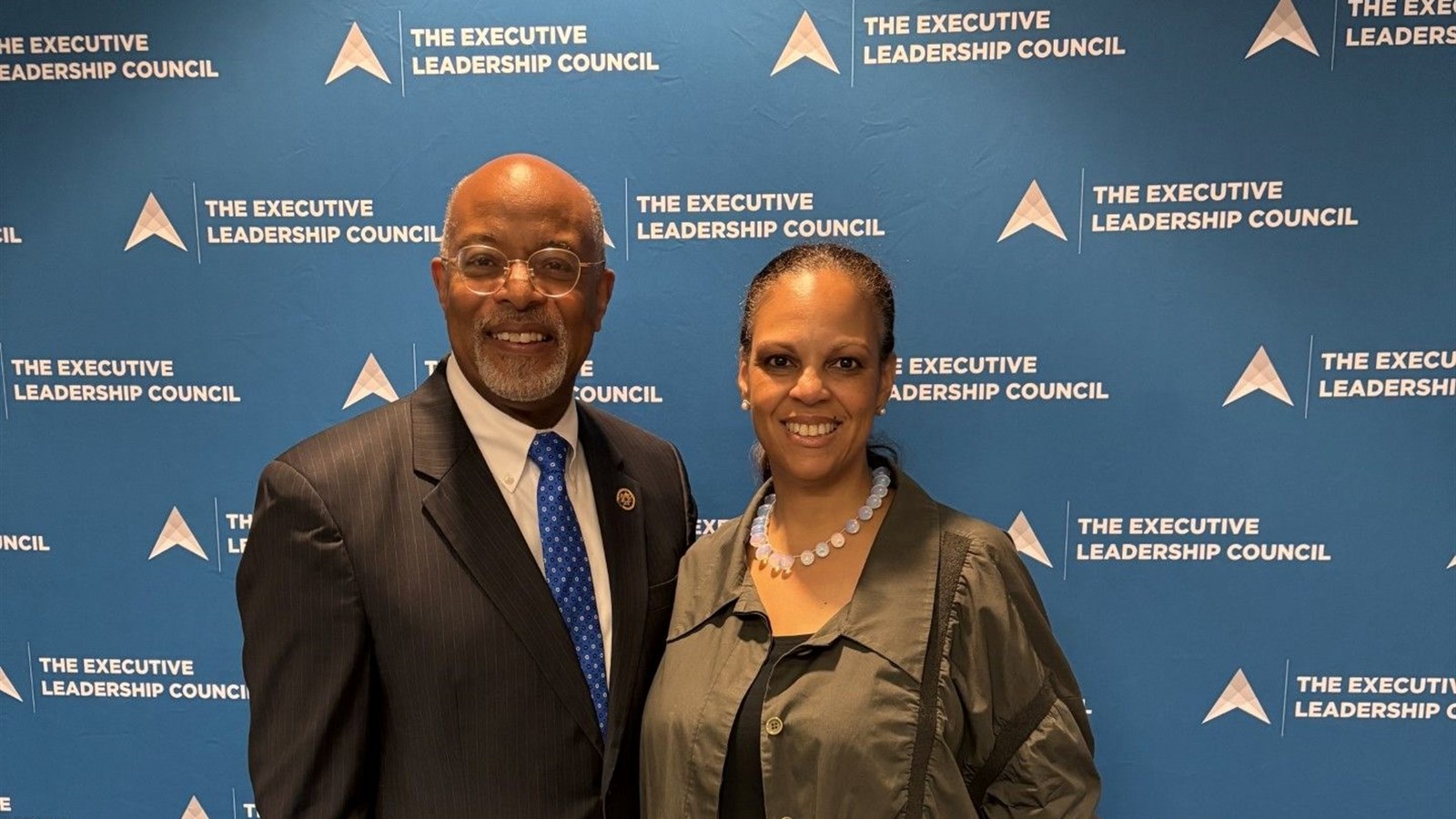 Libi Sprow Rice with a colleague in front of The Executive Leadership Council backdrop