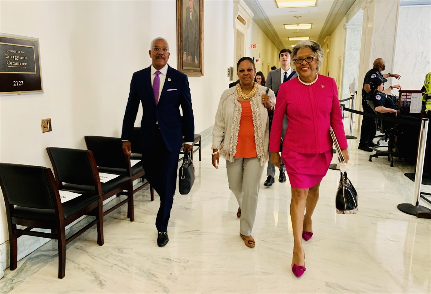 Libi Sprow Rice walking a House office building corridor with colleagues