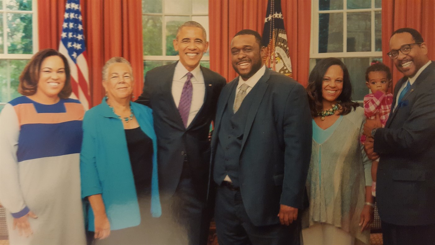 A framed photograph of Ronald C. Rice with President Barack Obama and guests